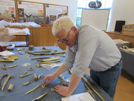 Jonathan King examining objects from the Arctic