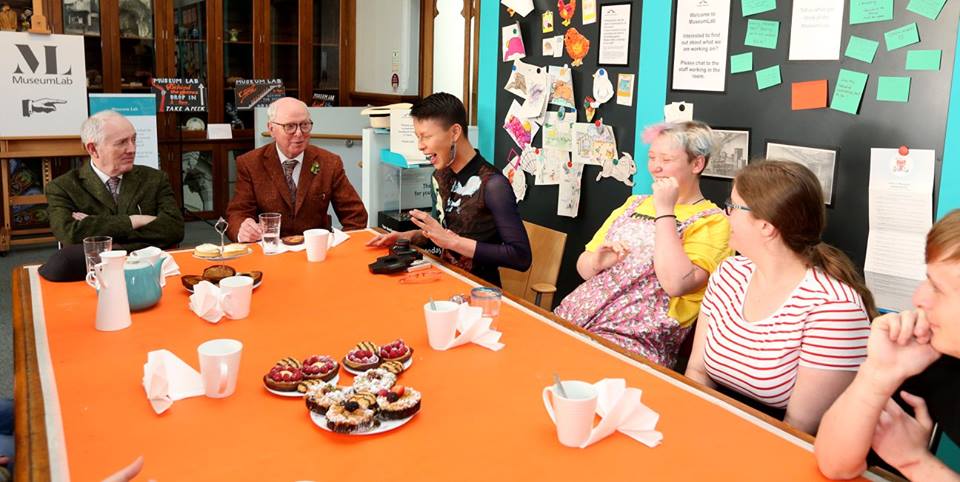 Gilbert & George having tea and cake with members of the Museum Collective