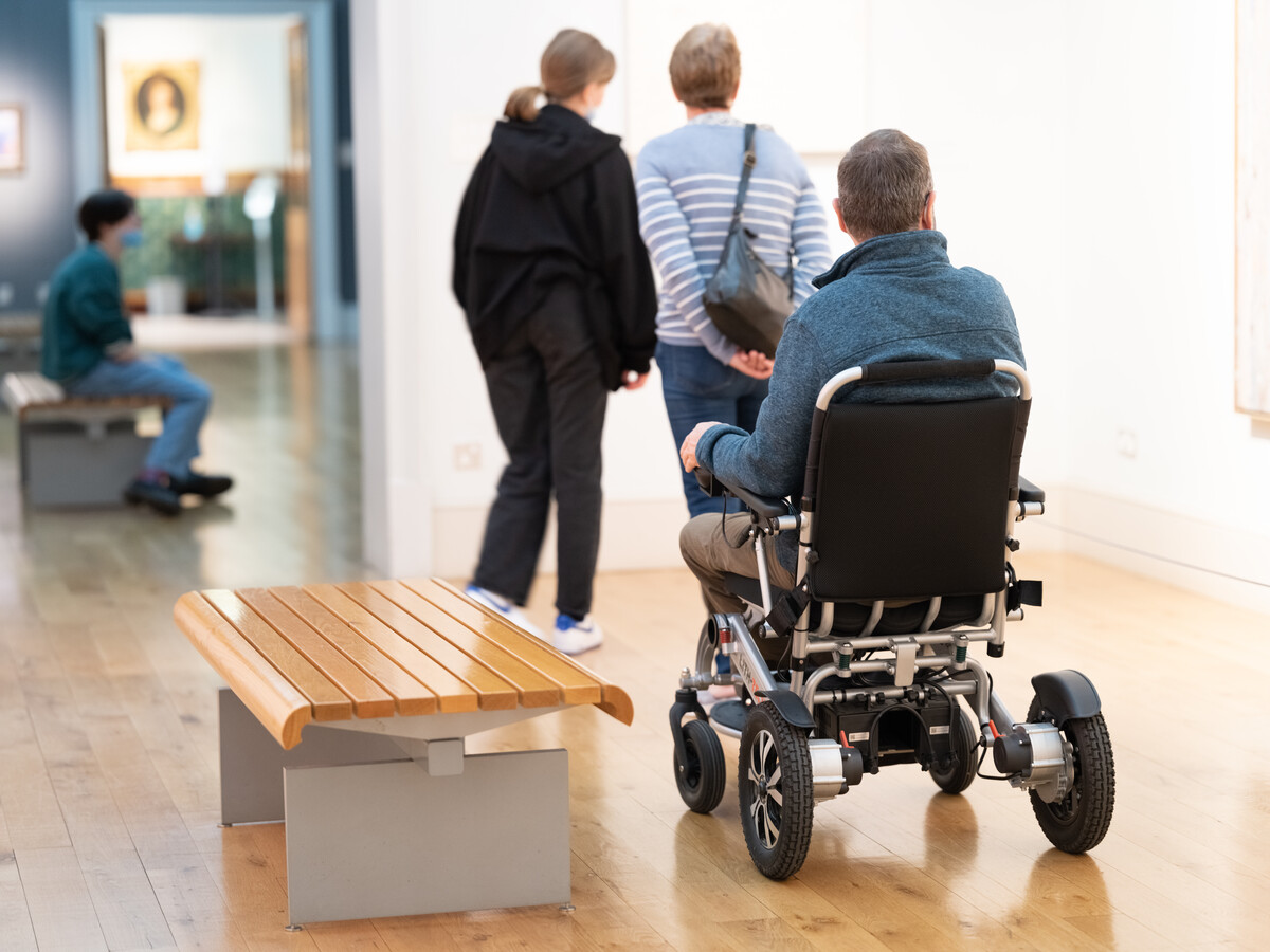 Person in wheelchair in gallery.
