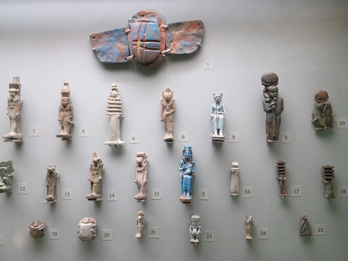 Display of small Ancient Egyptian figures.