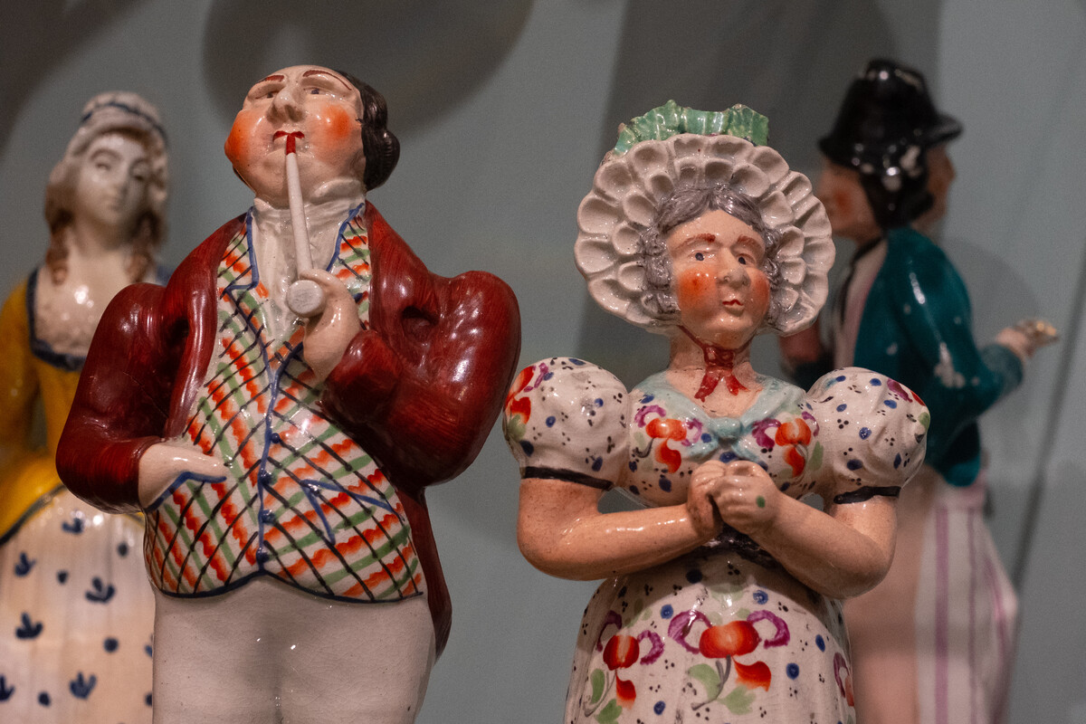 Ceramic figures of a man and woman.