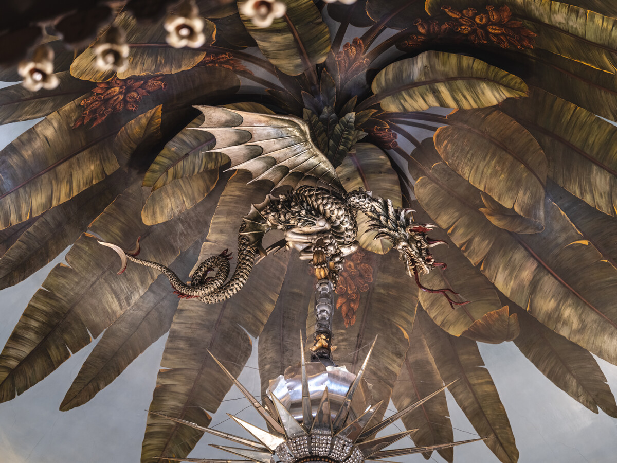 Dragon holding chandelier.