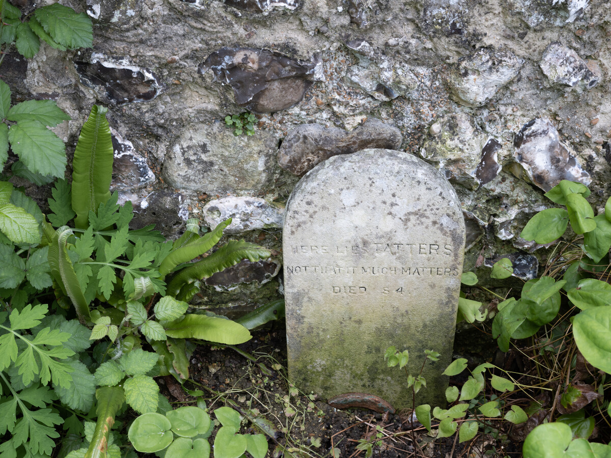 View of a grave stone in the garden.