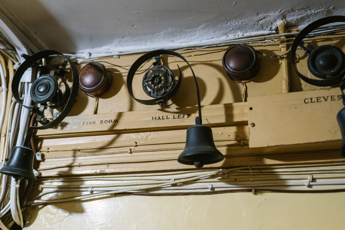 Row of servants' bells marked by room.