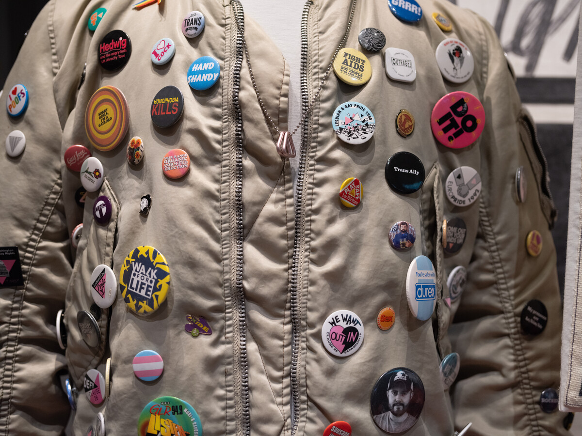 Jacket with numerous badges.