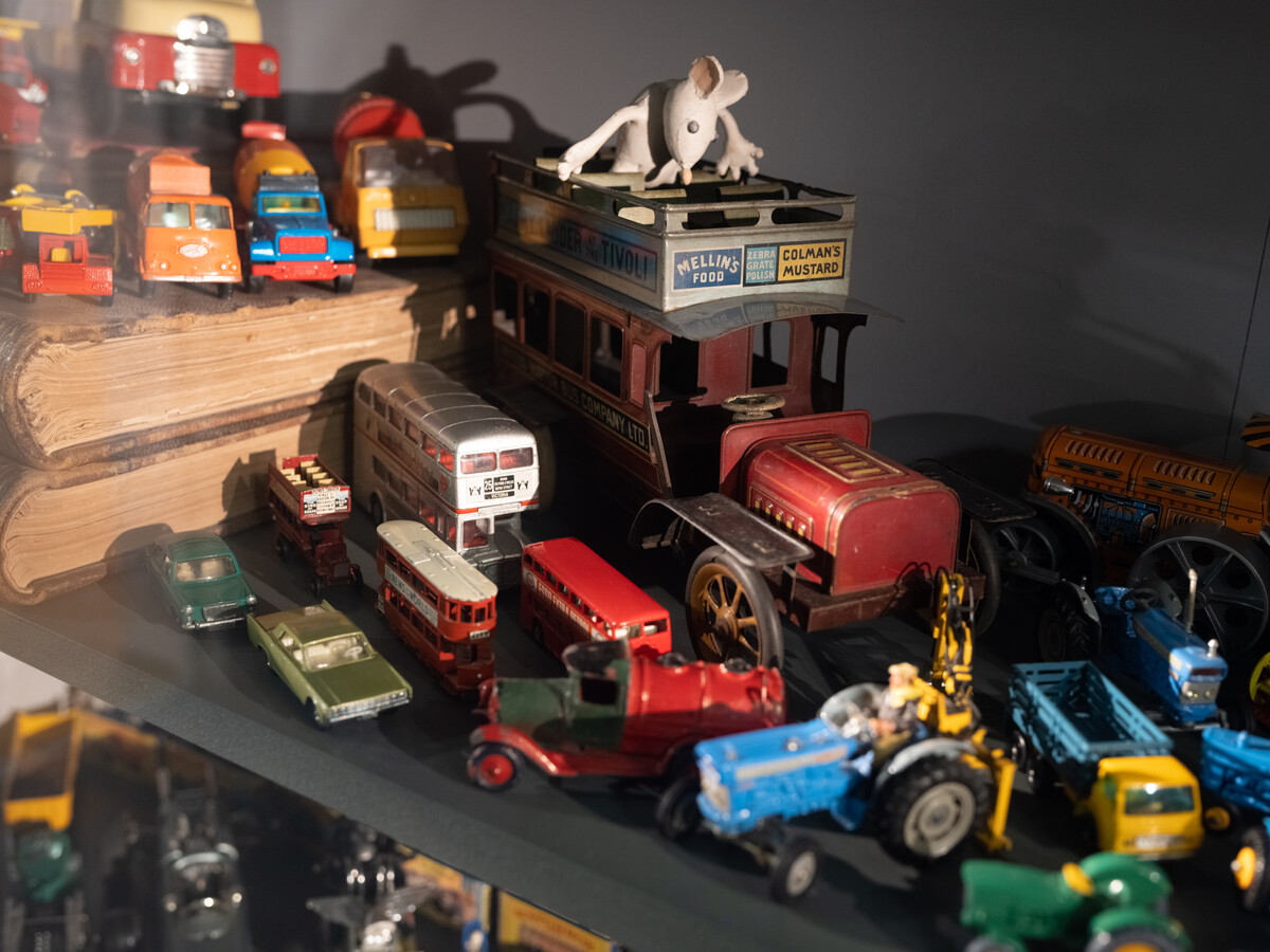 Selection of yous including a model bus with a fabric mouse sitting on top.