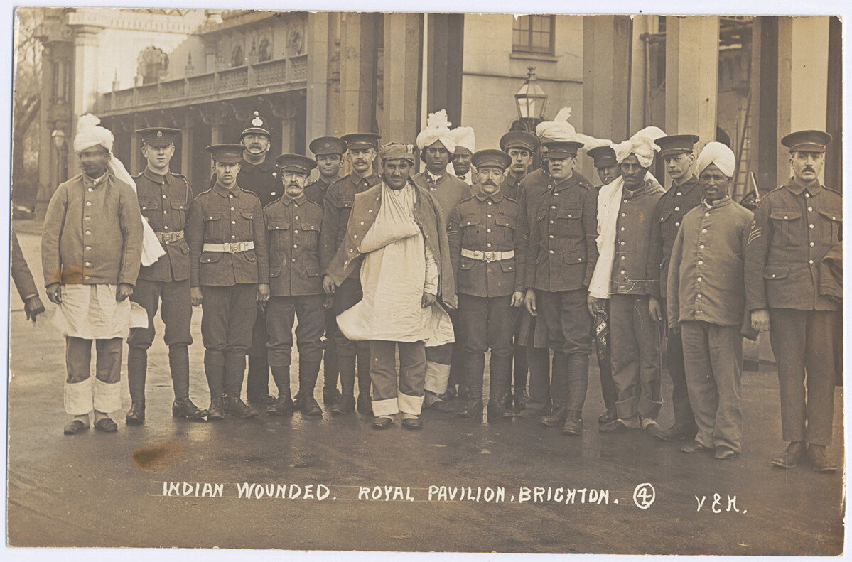Group portrait of wounded Indian soldiers and orderlies outside the Royal Pavilion