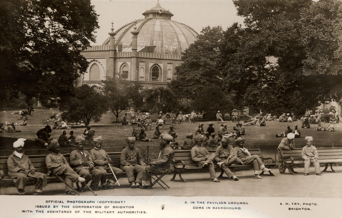Indian soldiers resting in Royal Pavilion Garden with Dome in background
