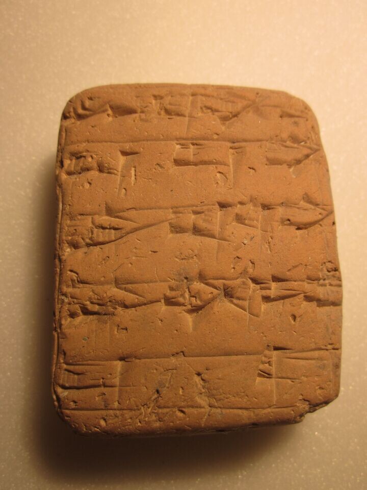 Stone tablet with cuneiform writing