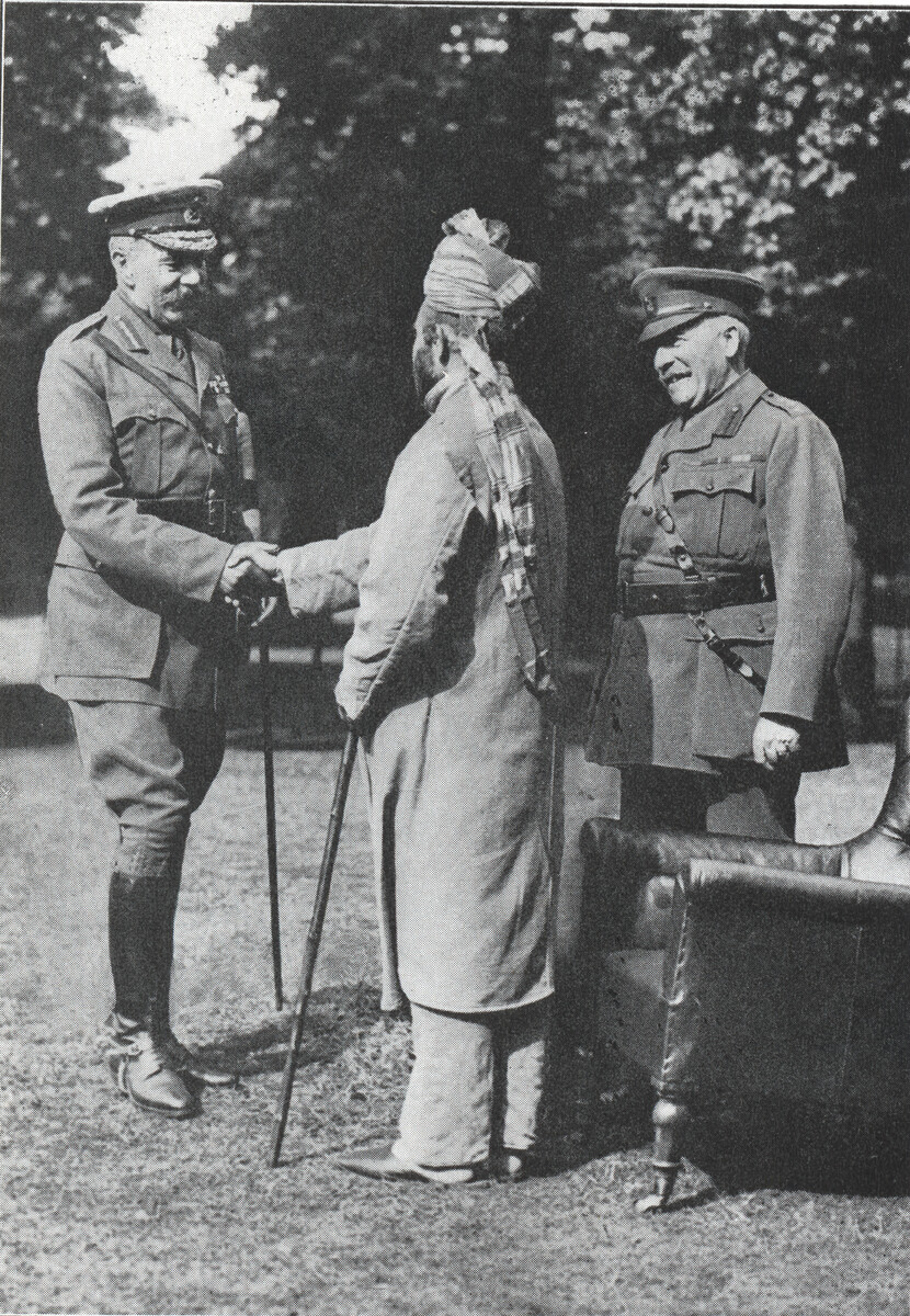 Man shaking hands with a military officer
