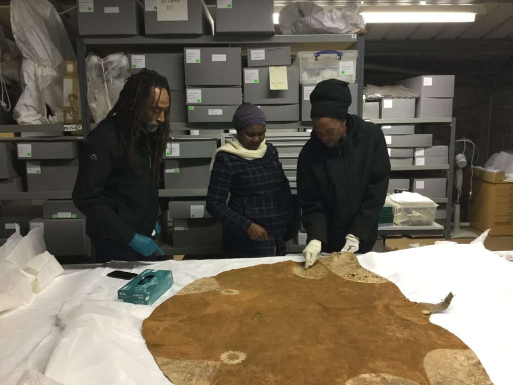 From left Tshepo Skwambane, RPMT, Winani Thebele, National Museum of Botswana and Scobie Lekhutile, Khama III Memorial Museum Serowe, examine the Botswana collection at RPMT.
