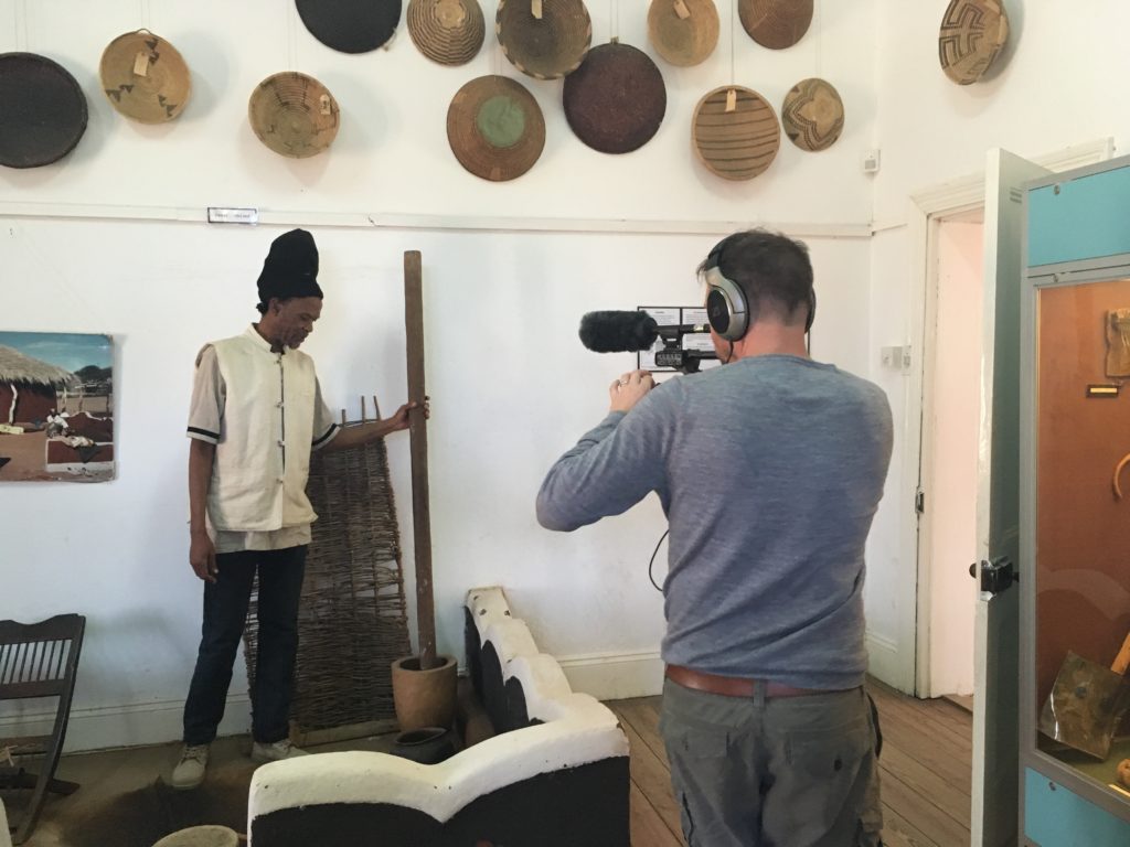 Scobie Lekhutile conducting a guided tour of the Khama III Memorial Museum displays. Filmed by John Reynolds project photographer and film-maker.