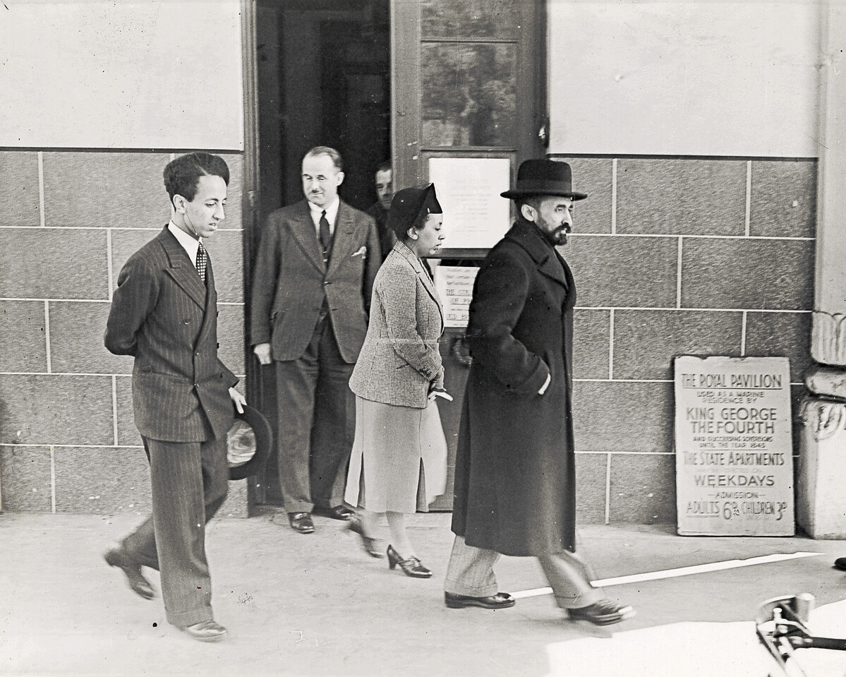 Haile Selassie and family walking outside the Royal Pavilion entrance