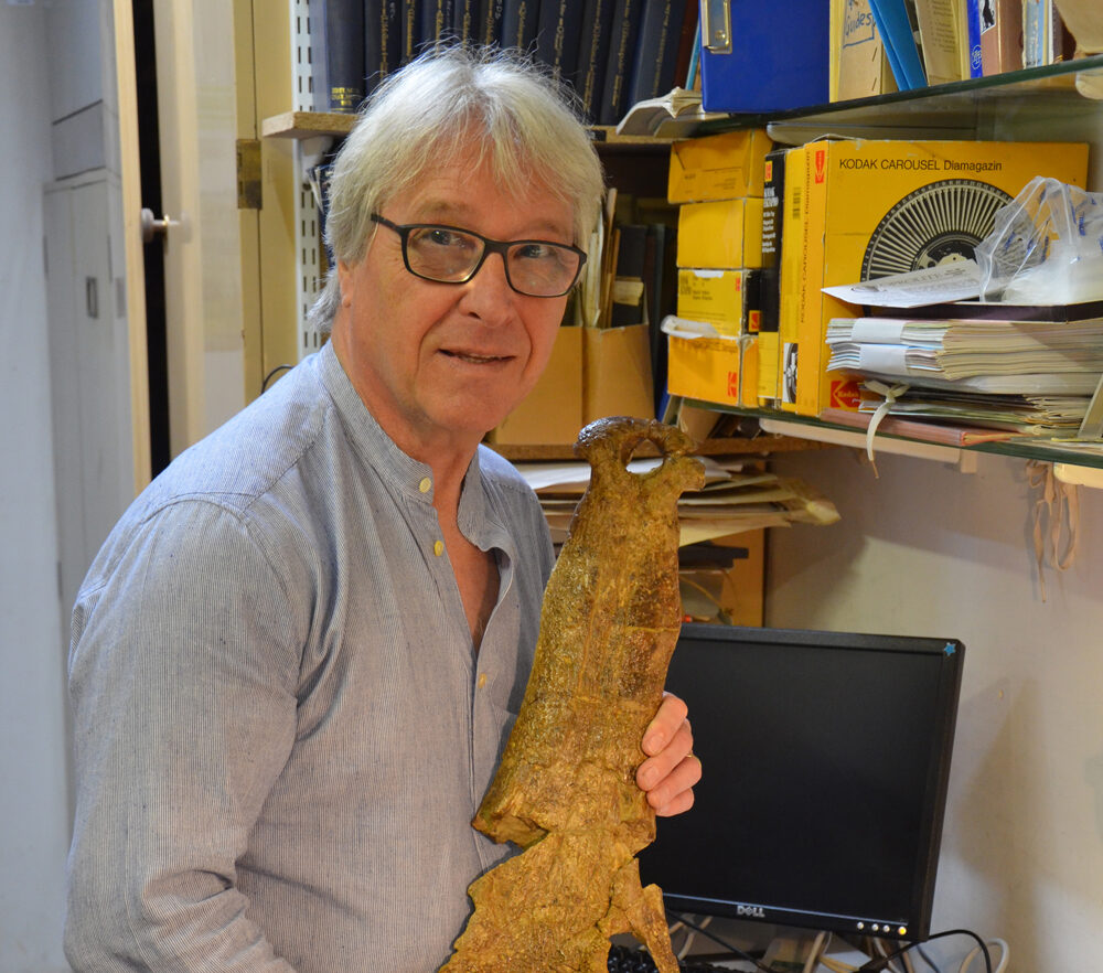 John Cooper with one of the most famous fossils in the Booth fossil collections “Mr. Willett’s Crocodile”
