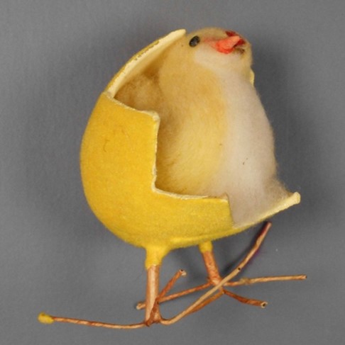 Toy chick coming out of egg