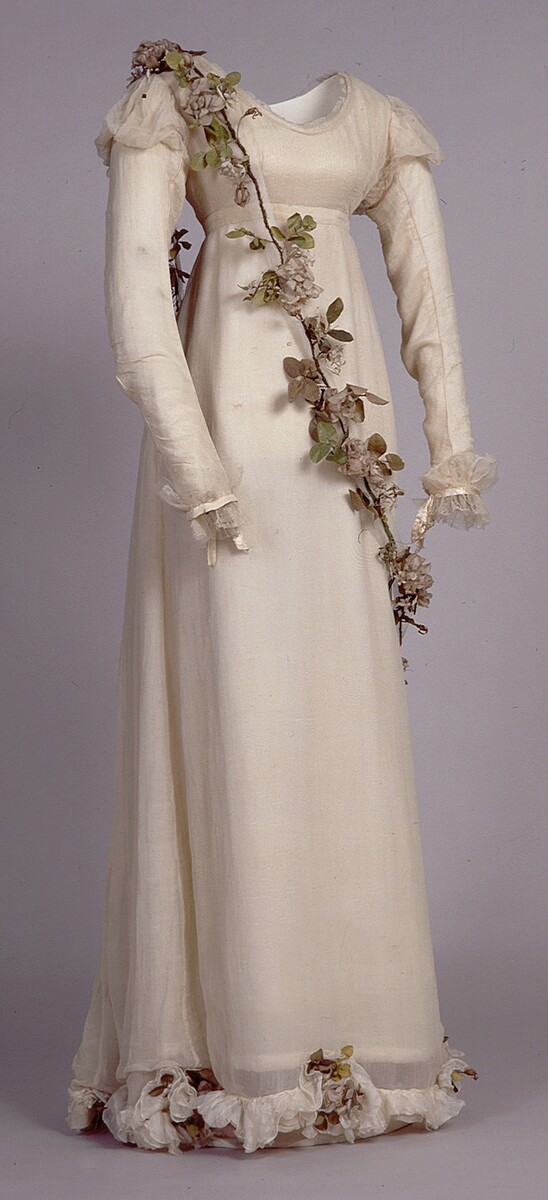 This dress and garland of artificial flowers was worn by Sarah Ann Walker at the coronation of George IV in 1821. She was one of six young attendants to the King’s Herbwoman.