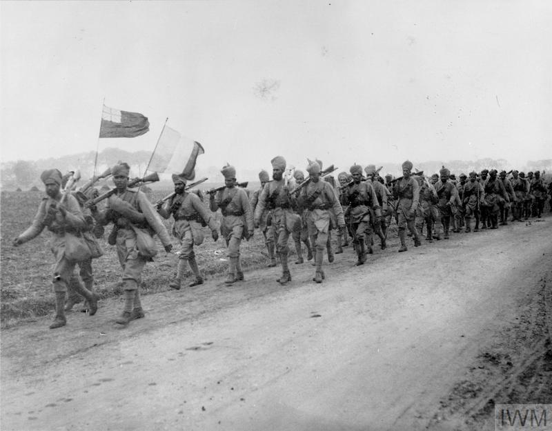 © IWM Q 109660 Indian soldiers marching with colour party in front, 1914