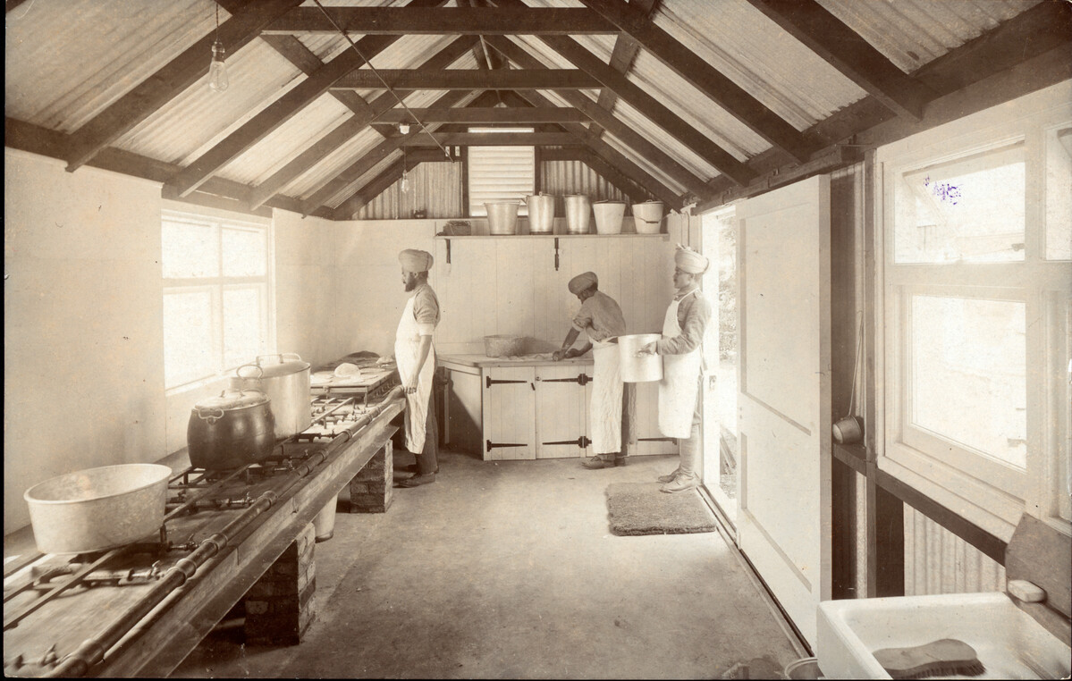 Soldiers cooking in a makeshift kitchen