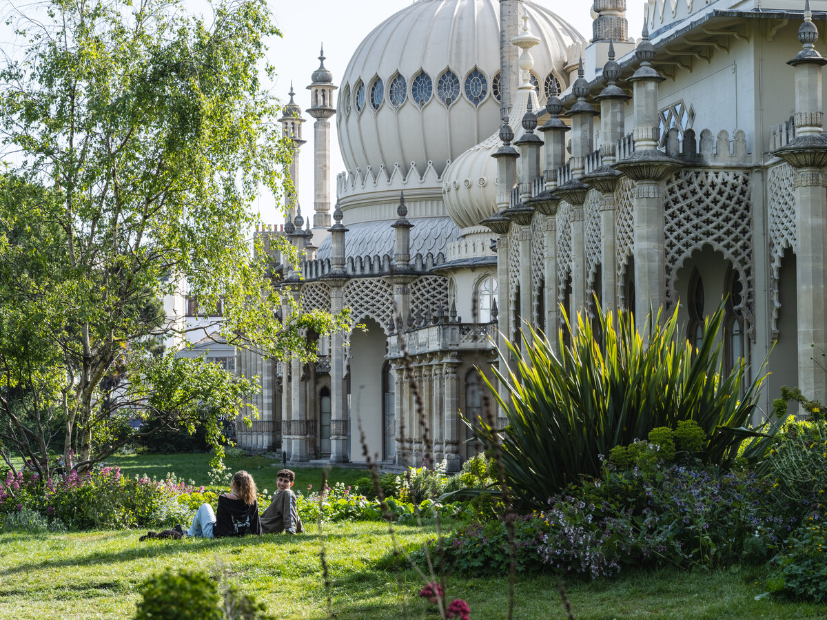 The Royal Pavilion Garden with people sitting on the lawn