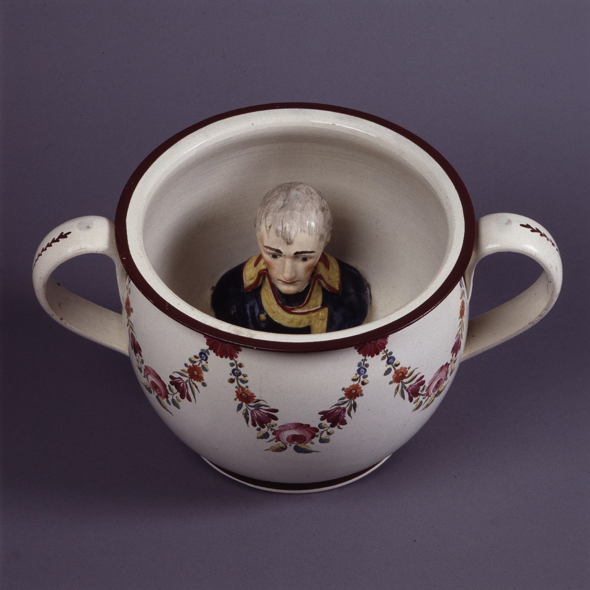 Napoleon as figure of derision, his ceramic half figure is within a chamber pot