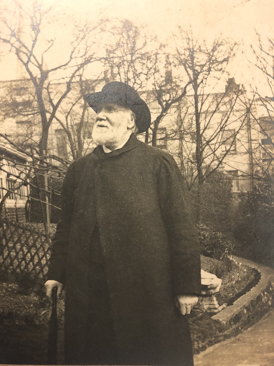Photograph of Henry Willett taken in 1903. Probably taken in the garden of Henry Willett's home, Arnold House, in Upper North Street, Brighton