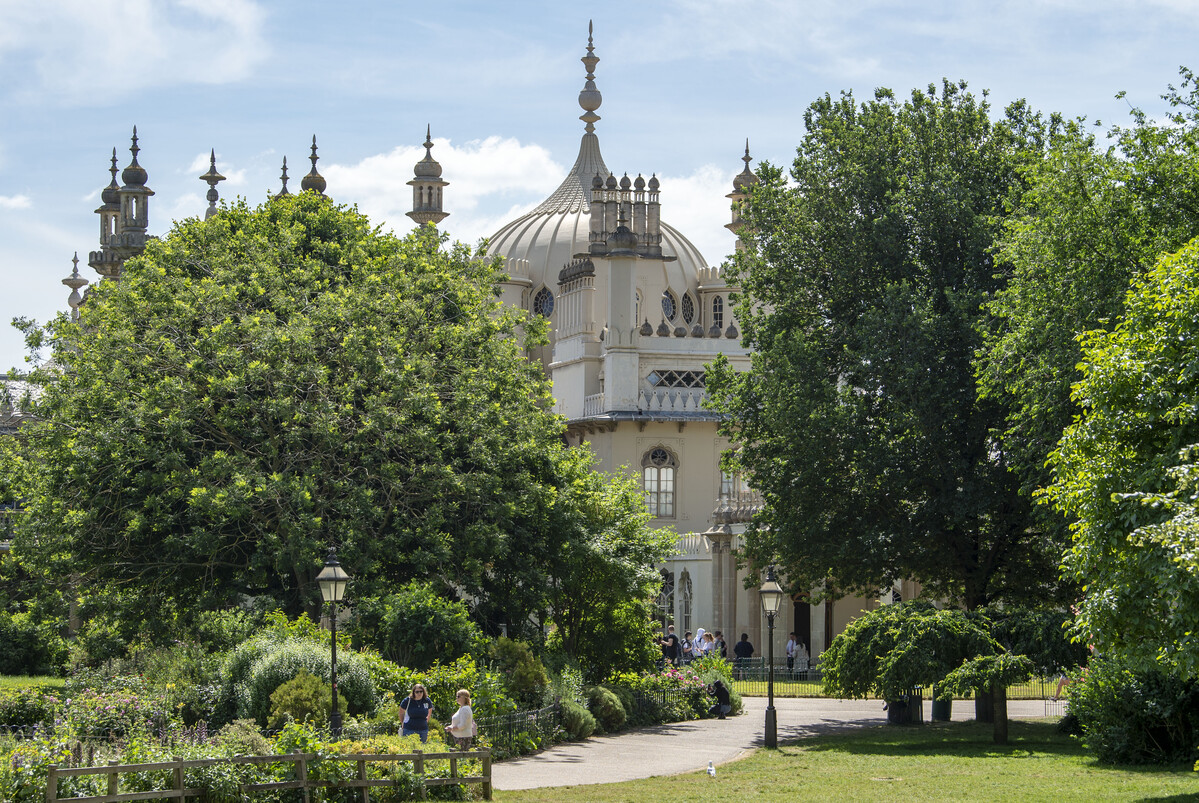 Royal Pavilion Garden showing trees and lamp posts along the path towards the Pavilion