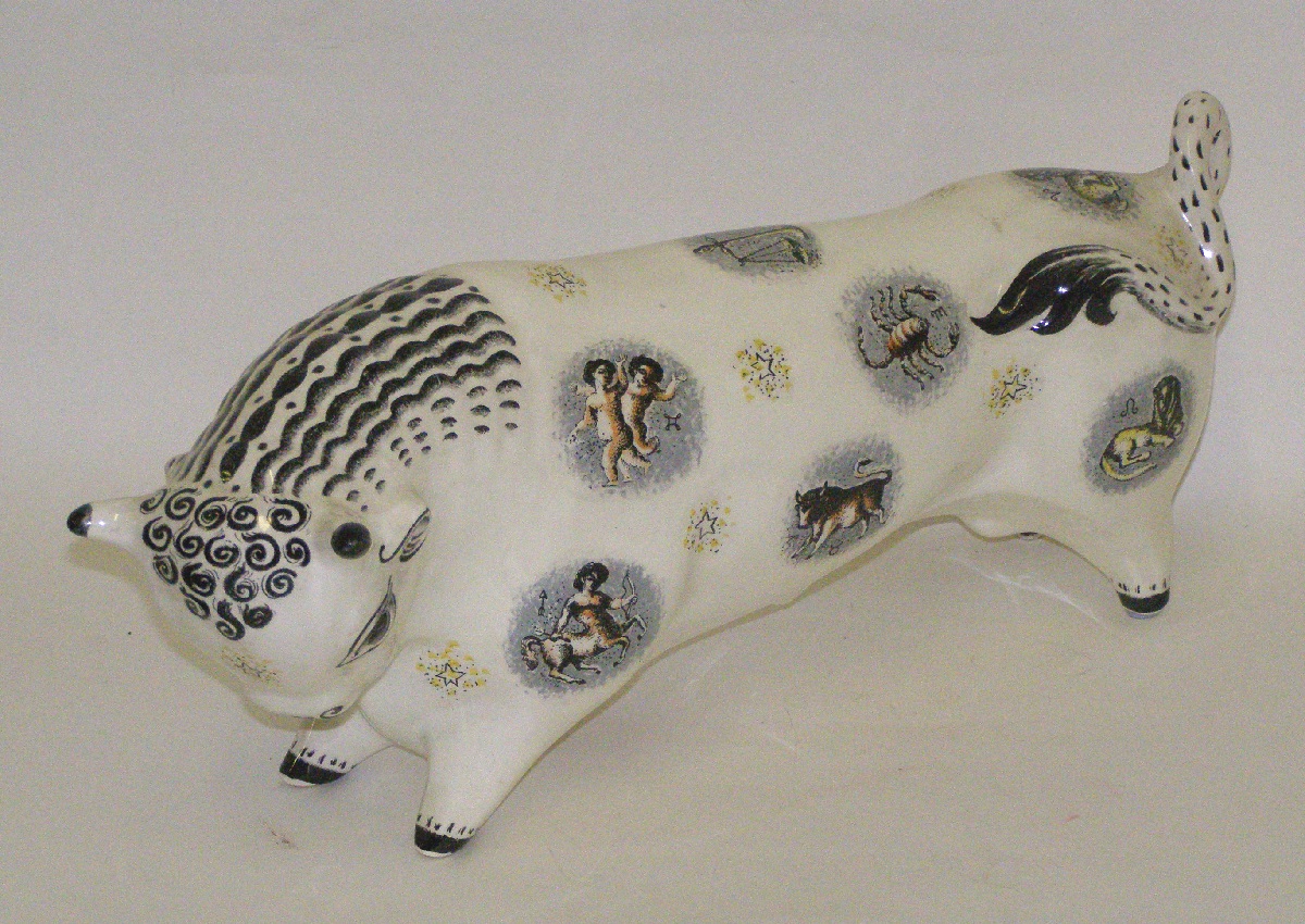 Taurus the Bull, Animal Figure by Josiah Wedgwood (& Sons Ltd); Arnold Machin. c1945. China bull in white decorated Queen's Ware with hair and signs of the zodiac in black, yellow, brown and grey.