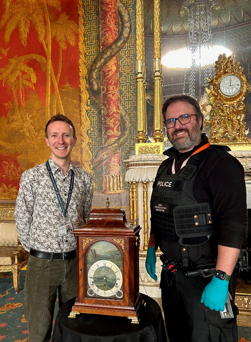 Brighton & Hove Museums Local History Curator Dan Robertson with Sussex Police RCT Sergeant Tom Carter with returned clock. © Brighton & Hove Museums