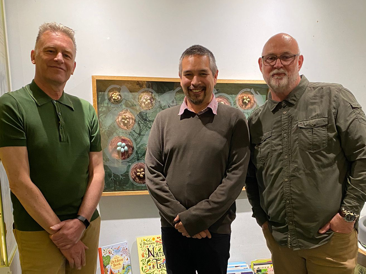 Chris Packham, Lee Ismail and Tony Ladd stand in front of the egg display at the Booth Museum