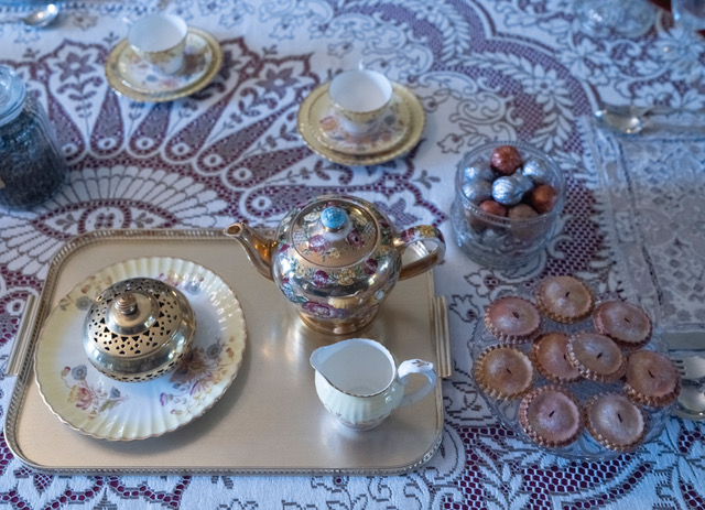 A nicely set - up table at Preston Manor with teapot, cups, and tea cakes