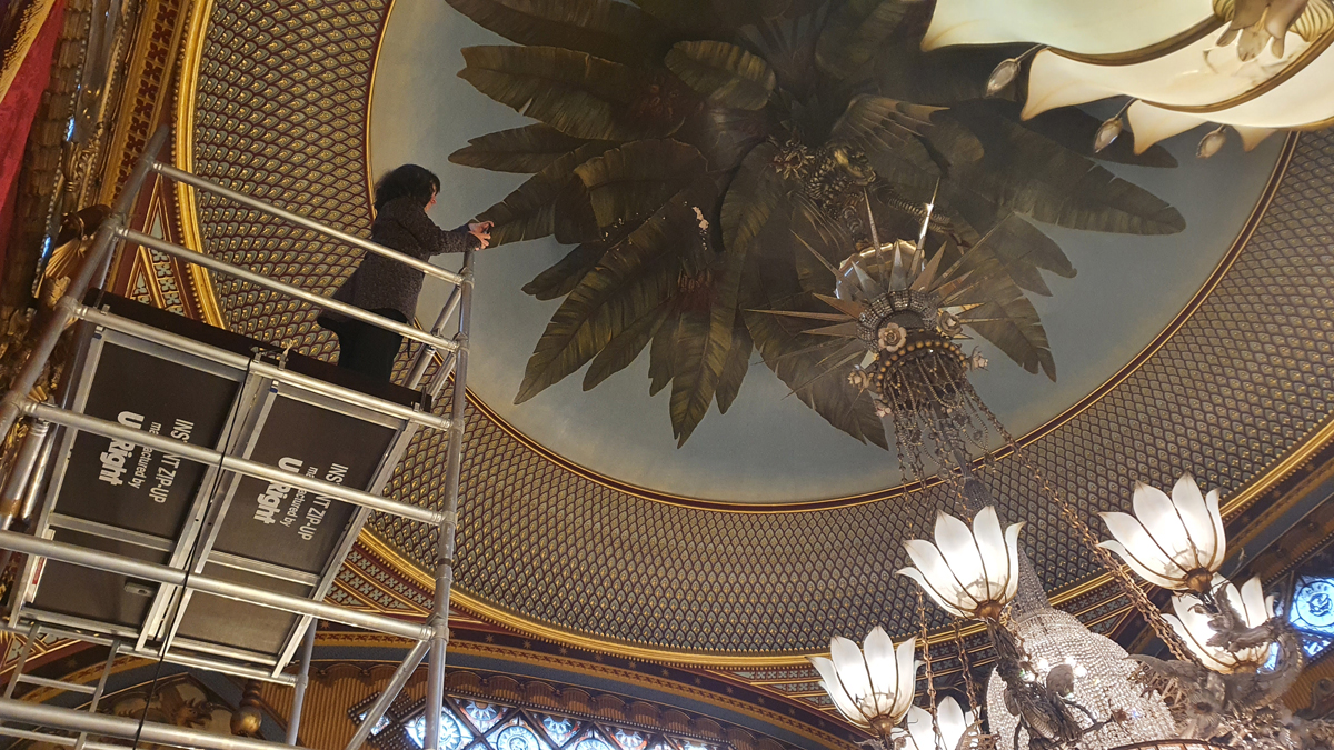 Alexandra on the scaffold tower looking at the chandelier