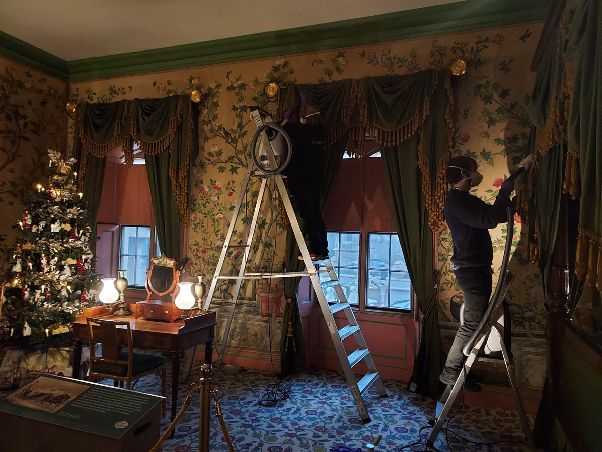 Tessa and Dom cleaning Queen Victoria's Apartment in the Royal Pavilion