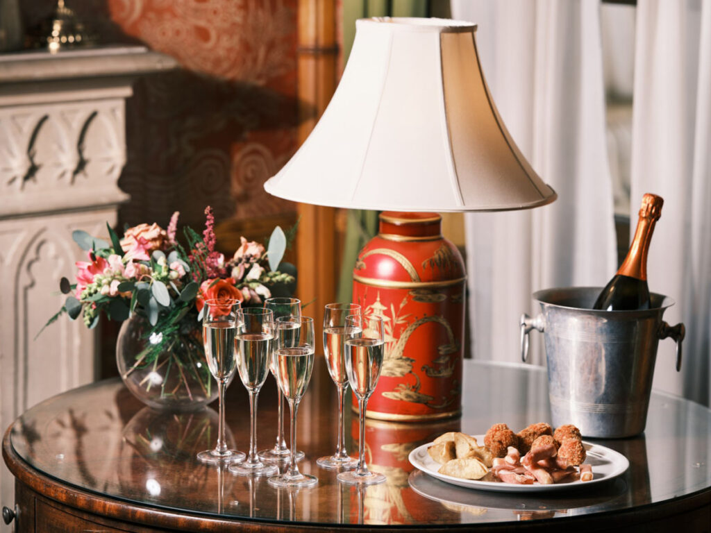 Red Drawing Red of the Royal Pavilion with wine glasses on a table