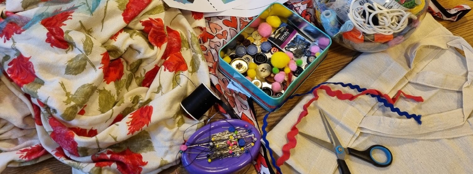 Rags to Riches event at the Royal Pavilion for COLOUR. Material and sewing tools are spread out on the table