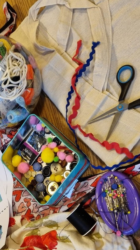 Rags to Riches event at the Royal Pavilion for COLOUR. Material and sewing tools are spread out on the table