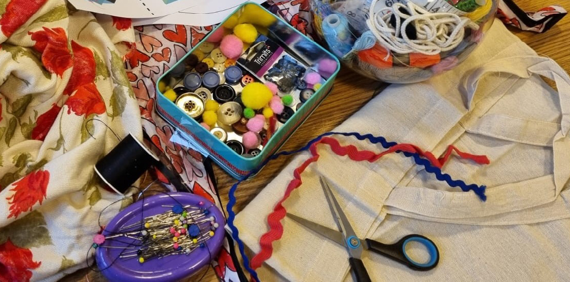 Rags to Riches event at the Royal Pavilion for COLOUR. Material and sewing tools are spread out on the table