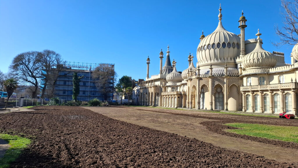 The rotavator in use on the East Lawn of the Royal Pavilion Garden to loosen the compacted soil