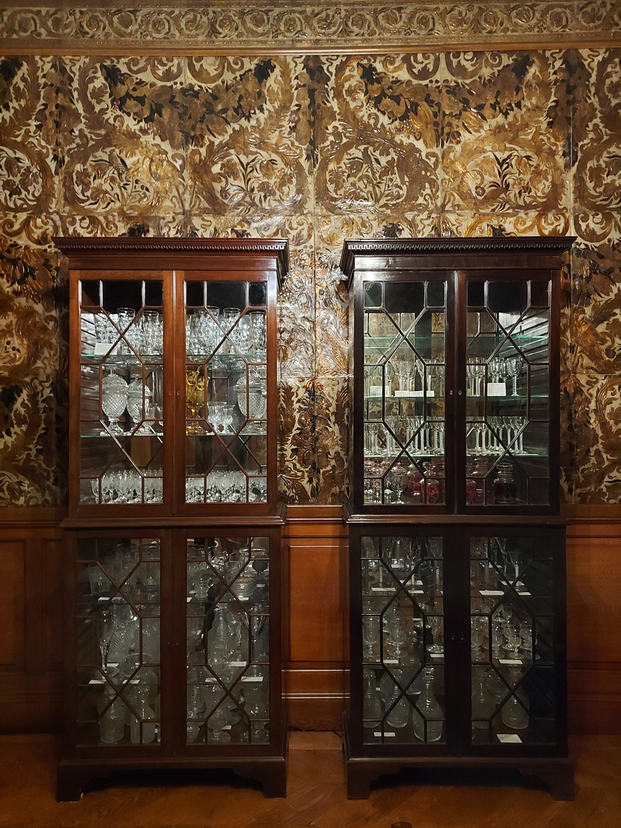 A matching pair of cabinets in the Cleves Room at Preston Manor. The left was previously displayed in what is now the café with higher light levels and has faded as a result.