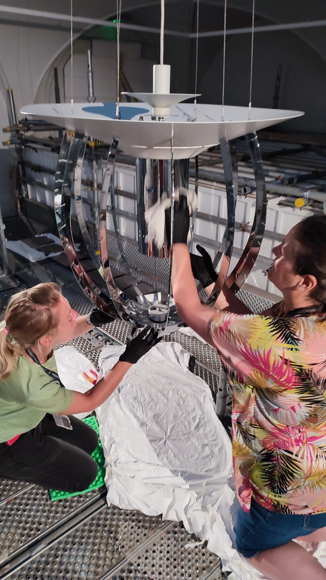 Jo and Lucy cleaning the spines from the scaffold.