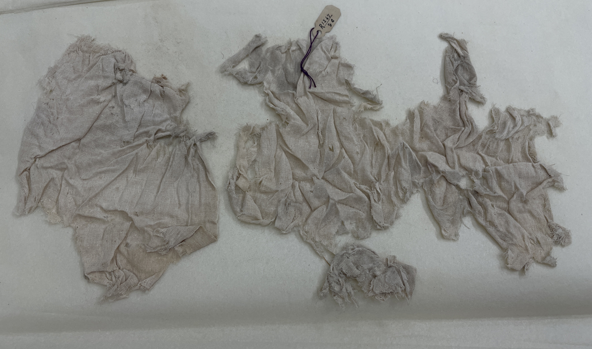 HA281514. Ancient Coptic textile, Dynasty 1 (3100-2890BCE), Tarkhan. Three fragments of very fragile textile. They are very finely woven linen, and lightweight with no other construction details of note.