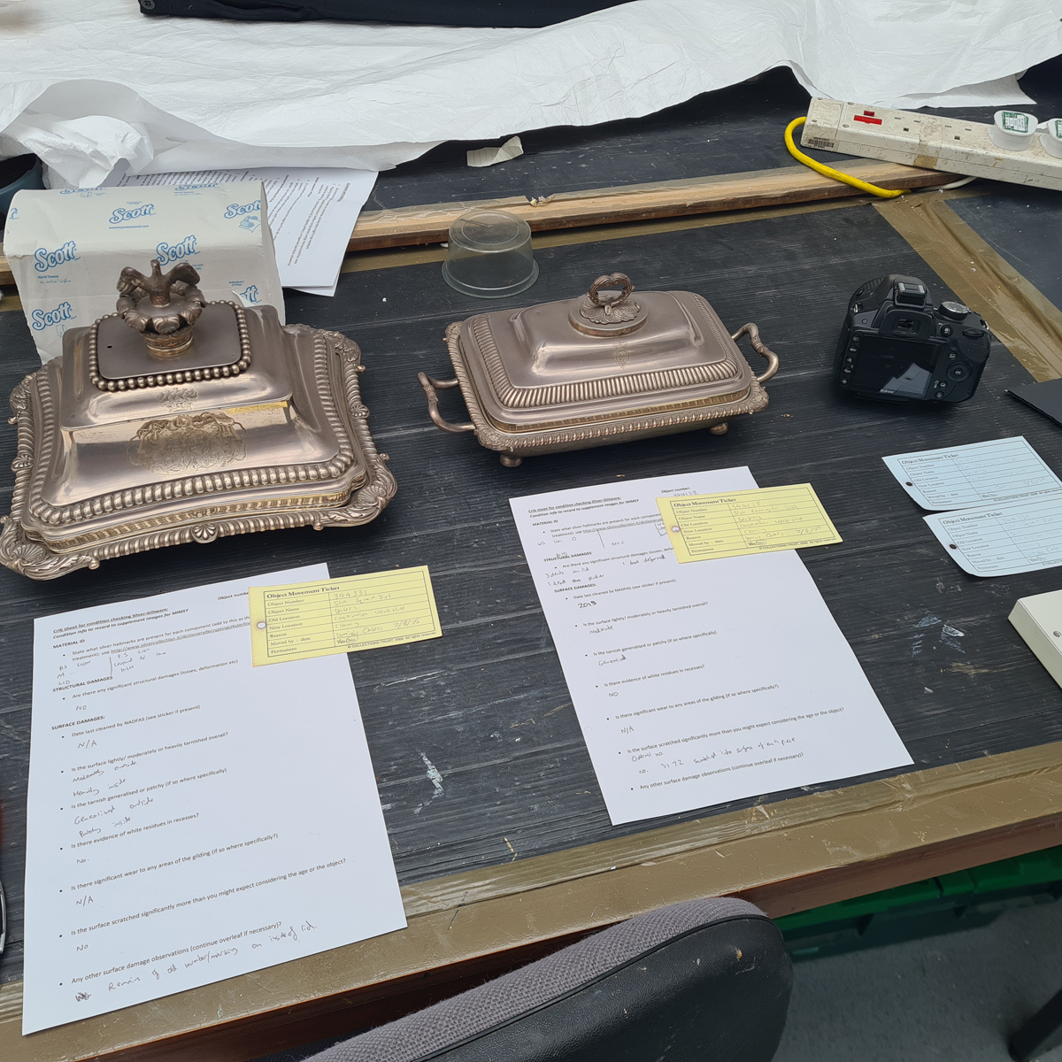 Two of the pieces with documentation detailing their condition