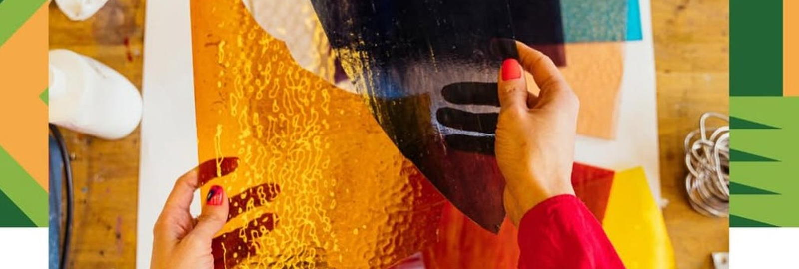 Mothers Uncovered Presents: Crafty Mothers. A woman's hands hold different colour craft paper for the workshop.