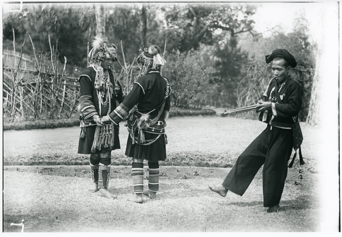 wap0083, Kaw [Akha] girls dancing to man and pipe. Burma image, credit James Henry Green Charitable Trust
