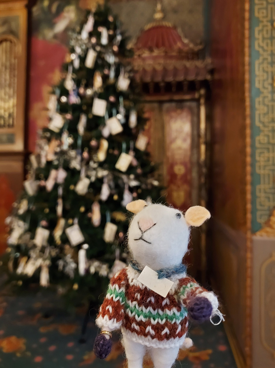 ConservRator getting in the Christmas spirit. All he wants for Christmas is a dust-free Pavilion. A toy mouse in a Christmas jumper is placed besides a Christmas tree in the Royal Pavilion