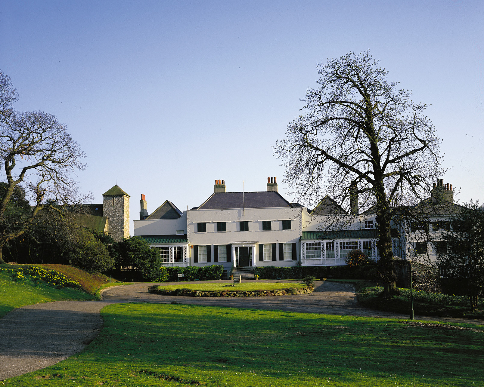 The front of Preston Manor, a long angled shot with the garden in the foreground