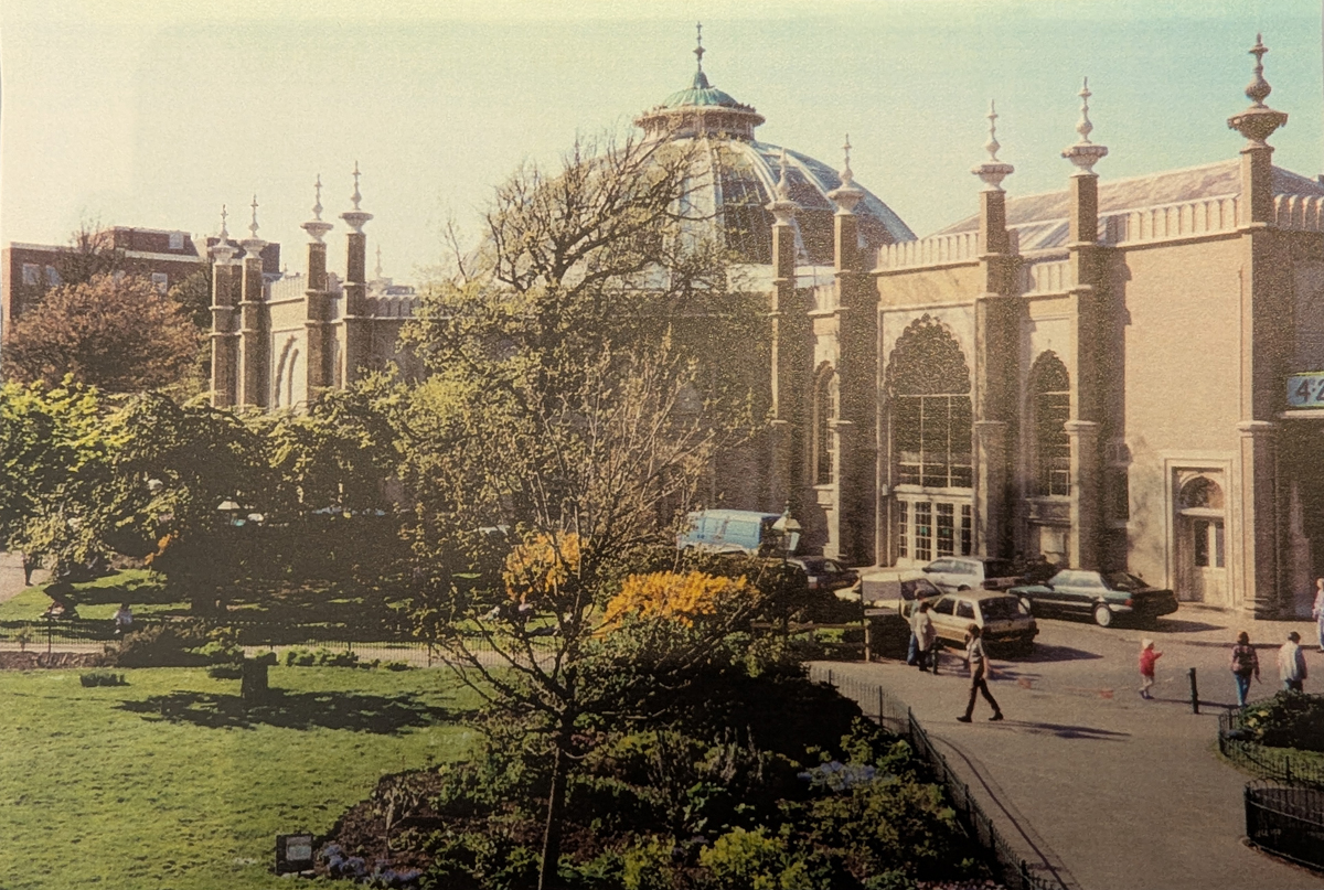 Royal Pavilion Garden, May 1996. The Dome and the side of Brighton Museum are visible in the background. People can be seen walking on the paths around the garden.