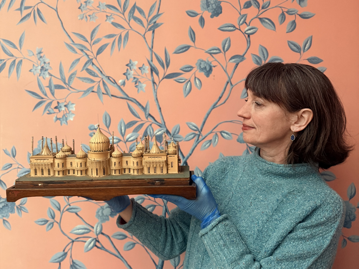 Alexandra Loske holds a model of the Royal Pavilion