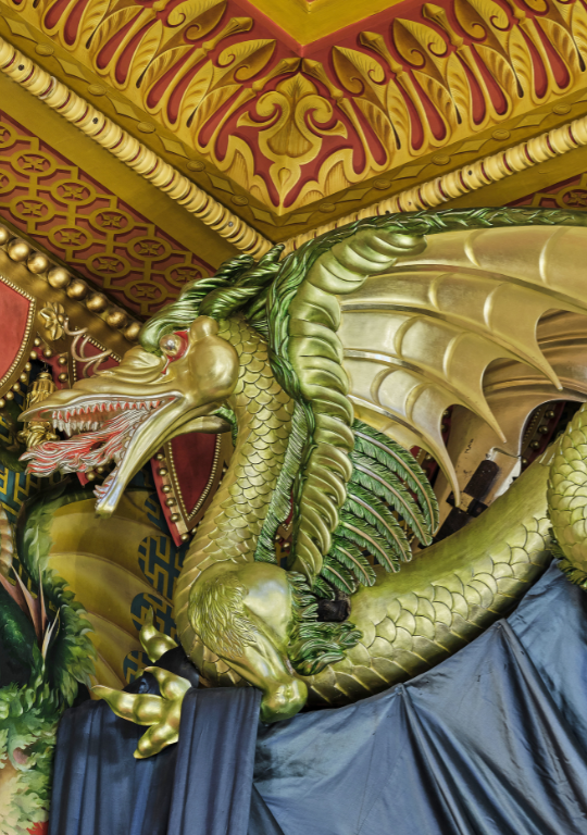 Carved, gilded dragon decorative element in the Music Room