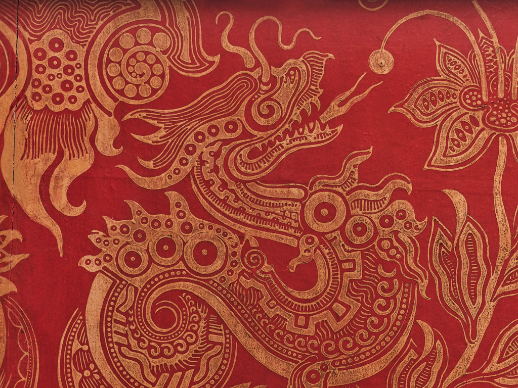 Dragons from the Royal Pavilion wallpaper. Gold dragons against a red background