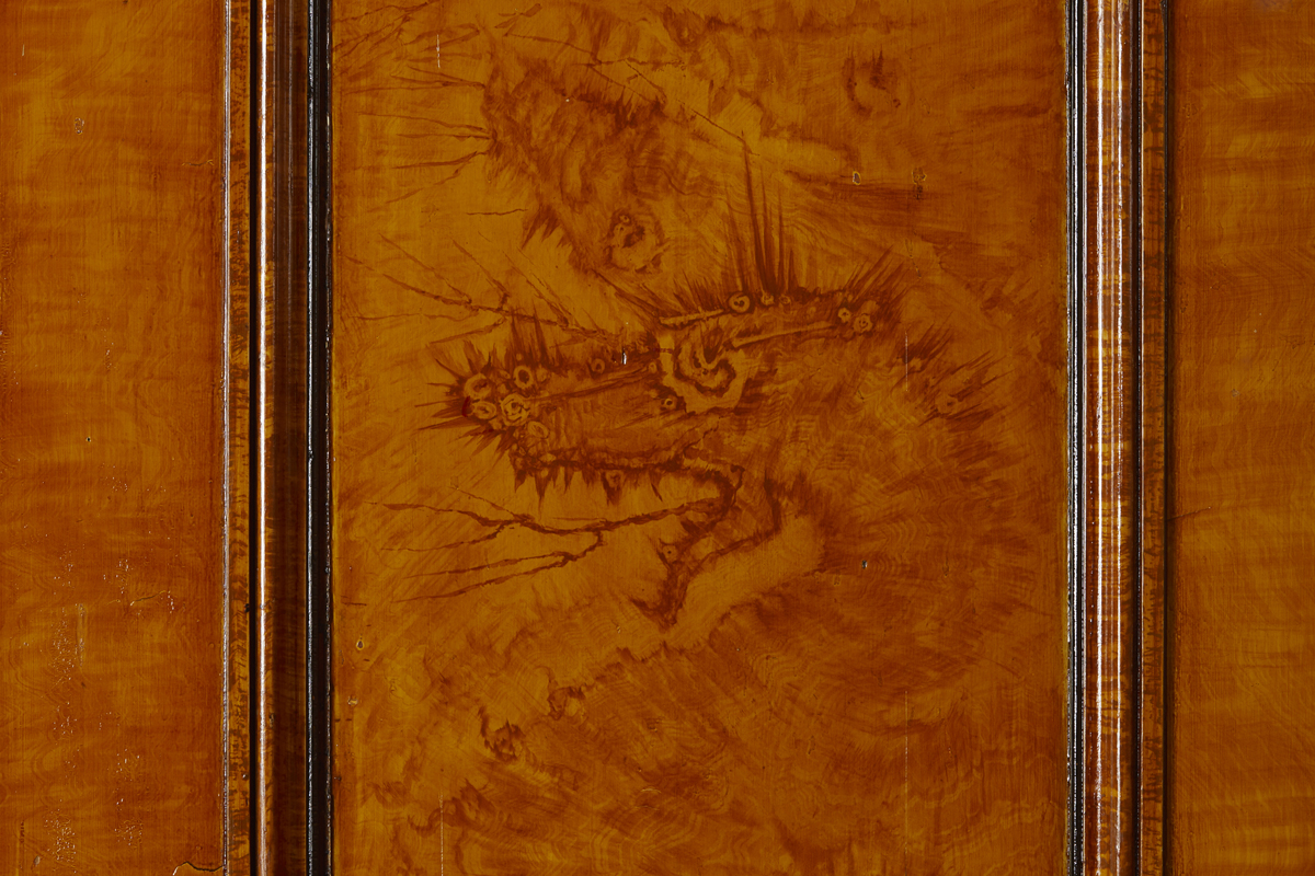 Hidden dragons in the Red Drawing Room. They are painted into the woodgrain effect and were designed in c1820 by Robert Jones.